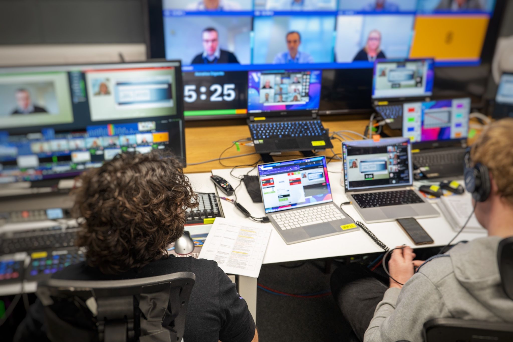 Multi-monitor production setup showing Stagetimer integrated with broadcast equipment at professional live event